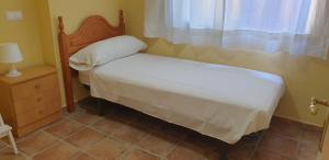 Posteľ alebo postele v izbe v ubytovaní Casa Hurtado de Mendoza pequeña