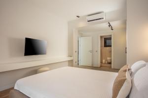 A television and/or entertainment centre at Enclave Villa Luxury,Pool and Nature at Marmaris