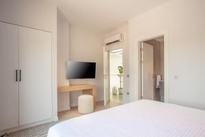 A television and/or entertainment centre at Enclave Villa Luxury,Pool and Nature at Marmaris