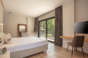 A bed or beds in a room at Enclave Villa Luxury,Pool and Nature at Marmaris Még 25 kép
