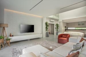 A television and/or entertainment centre at Enclave Villa Luxury,Pool and Nature at Marmaris