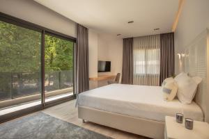 A bed or beds in a room at Enclave Villa Luxury,Pool and Nature at Marmaris
