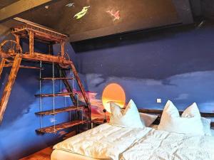a room with a bunk bed and a ladder at Zum süßen Stollen in Reinsfeld