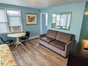 a living room with a couch and a table at Clarem Happy Days in Wildwood