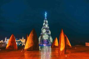 a christmas tree in the middle of a group of cones at Waterfront Sub-Penthouse with Beach View in Geelong