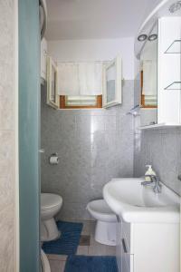 a bathroom with a sink and a toilet at Holiday house with a parking space Jadrija, Sibenik - 20641 in Šibenik