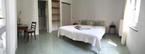 Postel nebo postele na pokoji v ubytování B&B Il Grotto