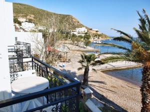 a balcony with a view of a beach at Silver Beach in Grikos