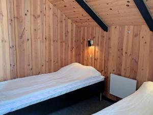 A bed or beds in a room at Holiday home Aakirkeby LXII