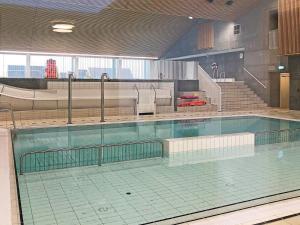a large swimming pool in a large building at Holiday home Thyborøn VI in Thyborøn