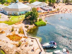 an aerial view of a beach with boats in the water at Holiday home Västervik III in Västervik