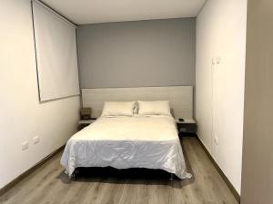 Łóżko lub łóżka w pokoju w obiekcie Exclusivo Armenia - Laureles Rodeado de Naturaleza