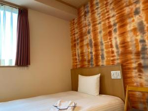 Postel nebo postele na pokoji v ubytování SAKURA SKY HOTEL KASHIWA(桜スカイホテル柏) + 28 fotografií
