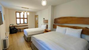 Llit o llits en una habitació de Island Flower Inn