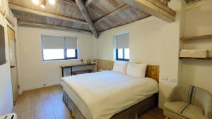 Llit o llits en una habitació de Island Flower Inn