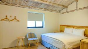 Llit o llits en una habitació de Island Flower Inn