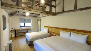 Llit o llits en una habitació de Island Flower Inn
