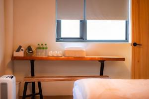 Llit o llits en una habitació de Island Flower Inn
