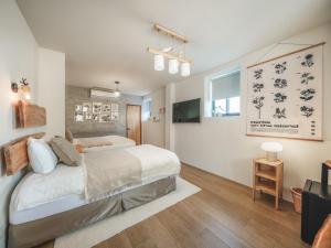 Llit o llits en una habitació de Island Flower Inn