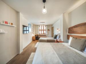 a bedroom with a bed and a large rug at Island Flower Inn in Nangan