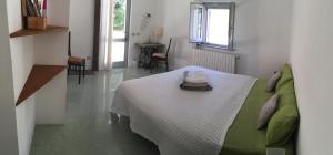 Postel nebo postele na pokoji v ubytování B&B Il Grotto