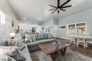 a living room with a couch and a table at Chillin At The Beach in Port Aransas +9 photos