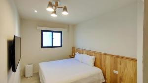 Llit o llits en una habitació de Island Flower Inn