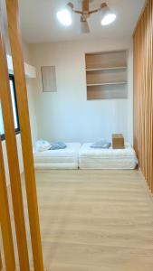 Llit o llits en una habitació de Island Flower Inn