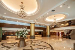 a lobby of a hotel with chandeliers at Hotel National in Taichung