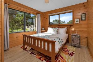 Voodi või voodid majutusasutuse Enchanted Retreat - Kerikeri Holiday Home toas