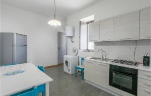 A kitchen or kitchenette at Nice Home In Modica With Wifi