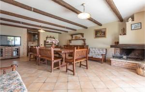 a dining room with a table and chairs and a fireplace at 7 Bedroom Stunning Home In Caiazzo in Caiazzo