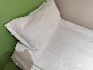 Voodi või voodid majutusasutuse 珀依旅馆 Pop E INN toas