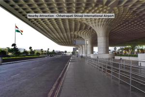a view of an airport terminal with an empty road at Flagship Hotel Prince Palace Near Juhu Beach in Mumbai