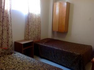 Ένα ή περισσότερα κρεβάτια σε δωμάτιο στο Hotel Estación Central