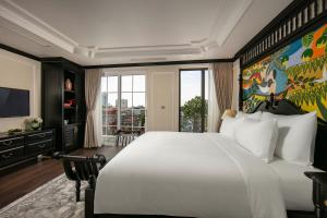 Letto o letti in una camera di Amira Hotel Hanoi