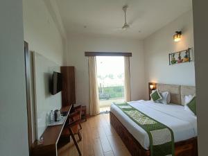 Ένα ή περισσότερα κρεβάτια σε δωμάτιο στο Hotel Dream Orchid