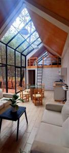 a large living room with a large glass ceiling at Bosquecielo in Huasca de Ocampo