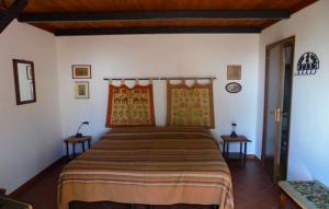 A bed or beds in a room at Baglio Delle Rose