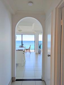 an open hallway with a view of the ocean from a house at Longbeach Luxe, Surfers Paradise in Gold Coast