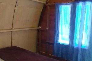 Postel nebo postele na pokoji v ubytování Penginapan puncak Dua Mitra RedDoorz