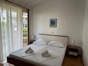Posteľ alebo postele v izbe v ubytovaní Apartment Vesela 2