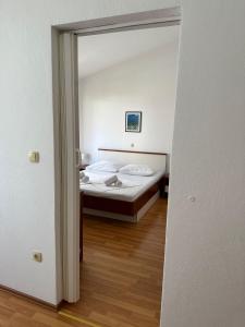 Posteľ alebo postele v izbe v ubytovaní Apartment Vesela 2