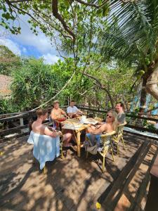 a group of people sitting at a table at Haadson Resort & Koh Raham in Haad Son