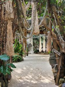 a hallway with a bunch of trees and vines at Haadson Resort & Koh Raham in Haad Son