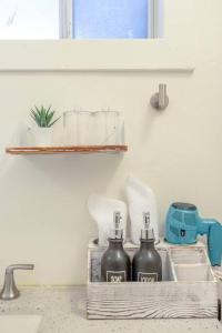 a kitchen counter with two bottles on a shelf at Home and Cottage in Mosswood in Oakland