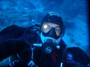 a man in a diving suit and a gas mask at Casa tra Cielo e Mare in Lipari