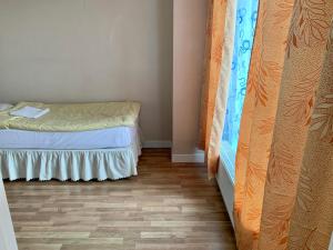 a bedroom with a bed and a wooden floor at 2 bedrooms apartment in Ulaanbaatar
