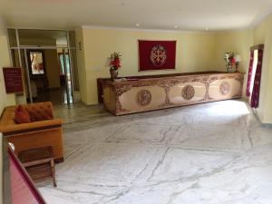 a living room with a large marble floor and a couch at The Druk Ladakh in Leh