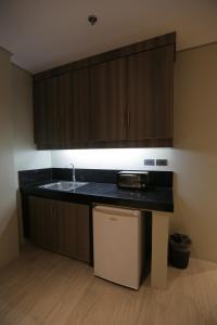 a kitchen with a sink and a counter top at PILAR MARINA INN in Pilar